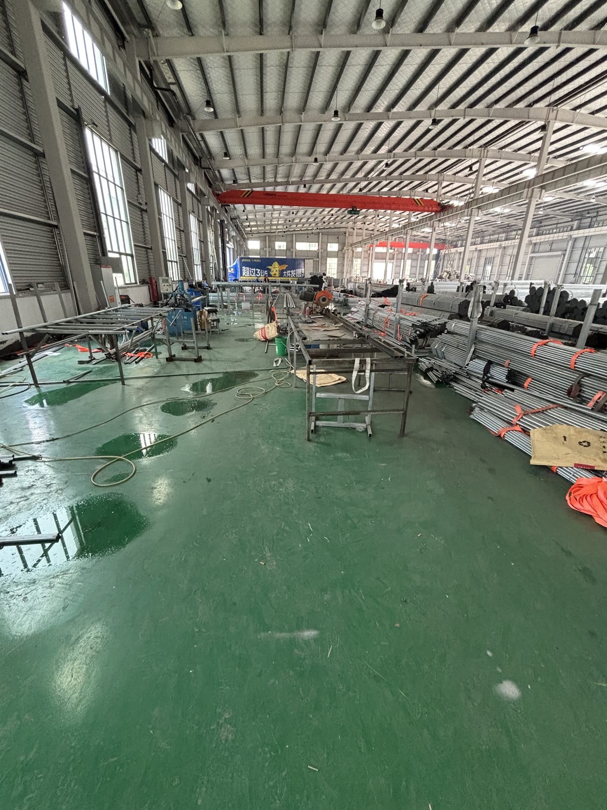Greenhouse frame processing area with tube stock and work benches